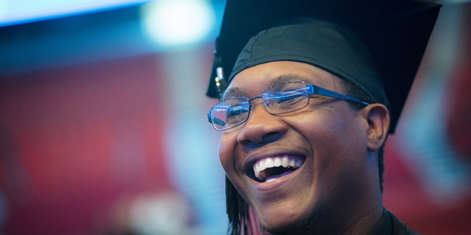 African-American young man in a graduation cap and tassel.